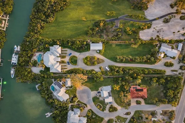 an aerial view of a residential houses with outdoor space