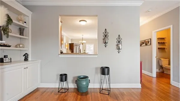 a view of a dining room with furniture and wooden floor