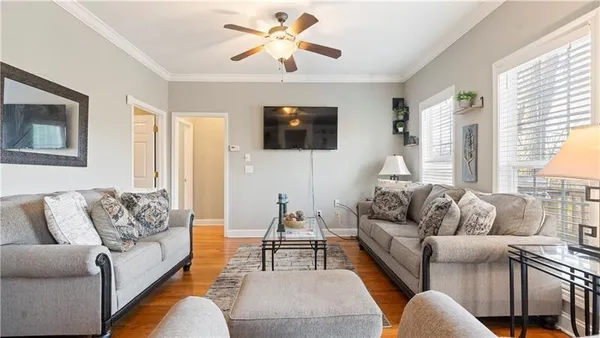 a living room with furniture and a flat screen tv