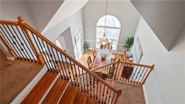 a view of an entryway wooden floor and door