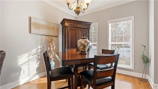 a view of a dining room with furniture window and wooden floor