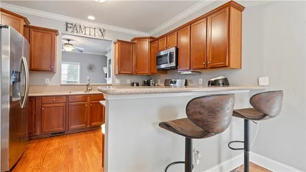 a kitchen with a sink cabinets and window