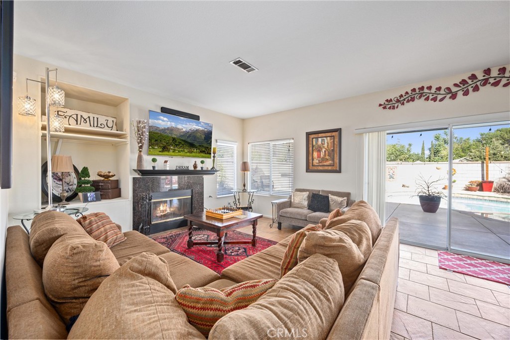 32853 Starlight Street Wildomar, CA 92595 - Photo 14 of 32 a living room with furniture and a flat screen tv