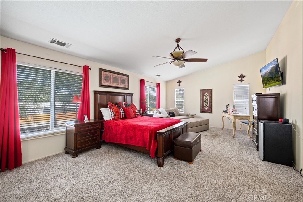 32853 Starlight Street Wildomar, CA 92595 - Photo 24 of 32 a bedroom with a bed and a tv