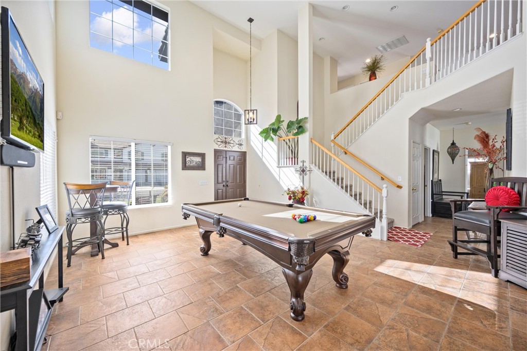 32853 Starlight Street Wildomar, CA 92595 - Photo 6 of 32 a living room with furniture a flat screen tv and a table