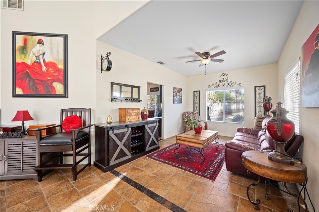 32853 Starlight Street Wildomar, CA 92595 - Photo 7 of 32 a living room with furniture a air conditioner and a window