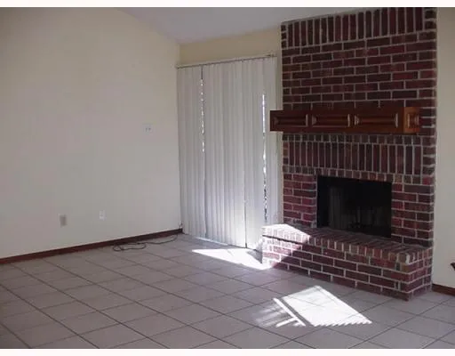 a living room with a fireplace