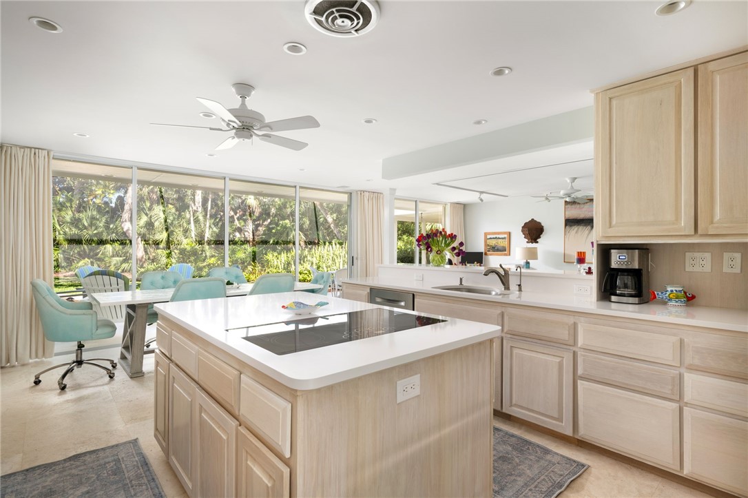315 Greytwig Road Vero Beach, FL 32963 - Photo 11 of 36 a kitchen with a sink stove and cabinets