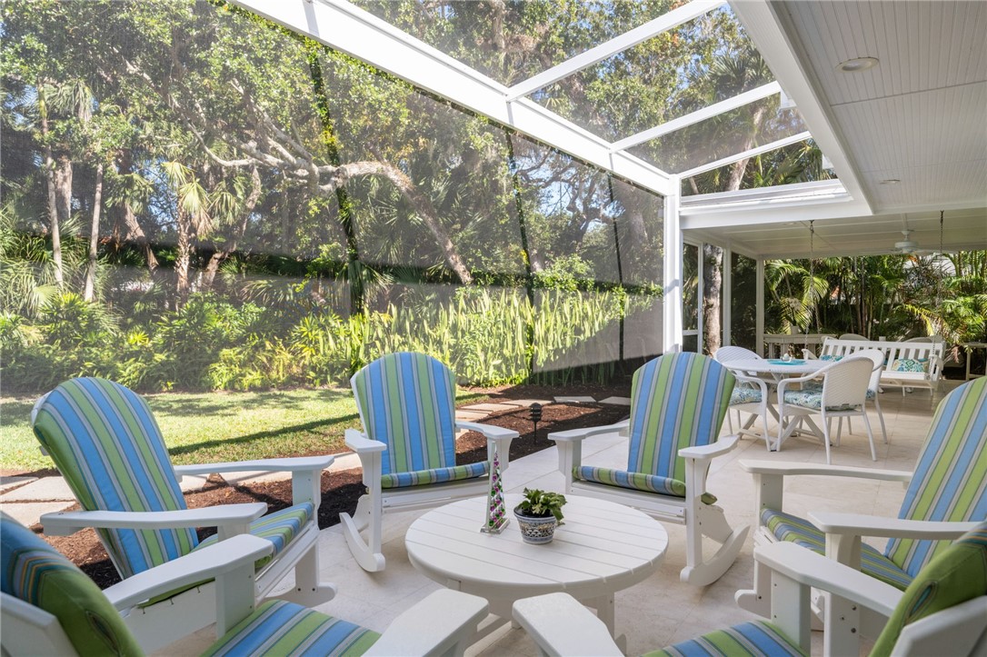 315 Greytwig Road Vero Beach, FL 32963 - Photo 14 of 36 a view of a patio with a dining table and chairs