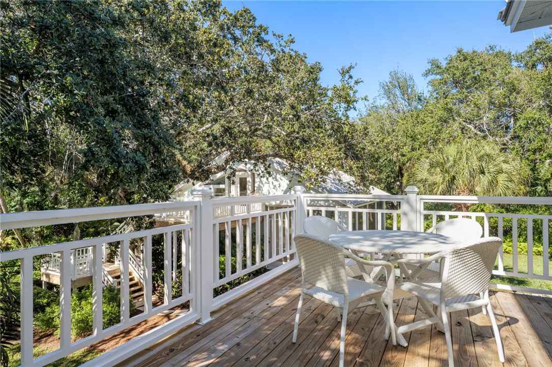 315 Greytwig Road Vero Beach, FL 32963 - Photo 24 of 36 a view of a chair and table on the wooden floor