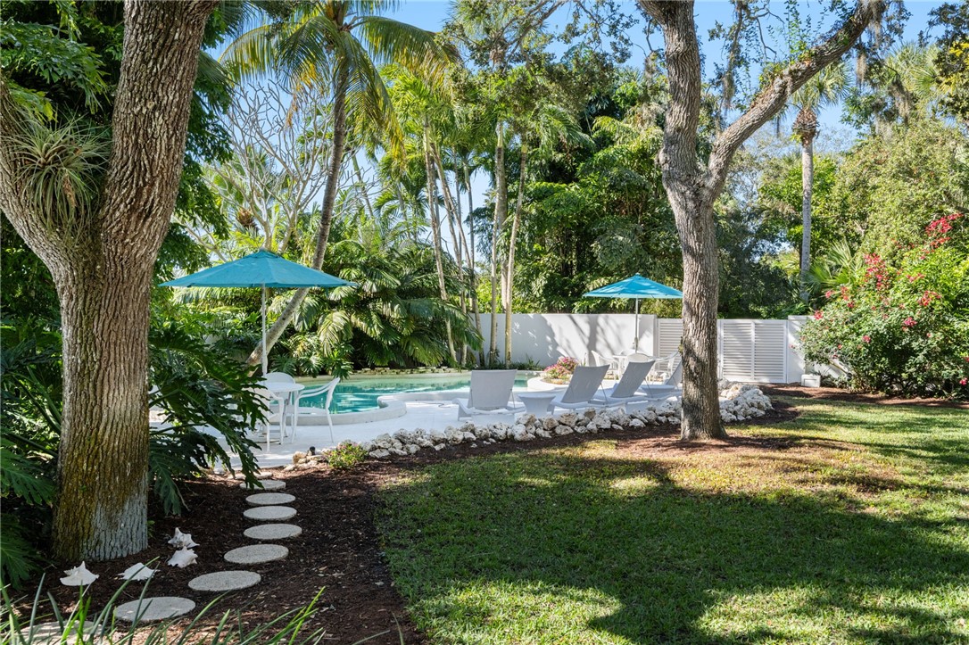 315 Greytwig Road Vero Beach, FL 32963 - Photo 34 of 36 a view of a backyard with plants and trees