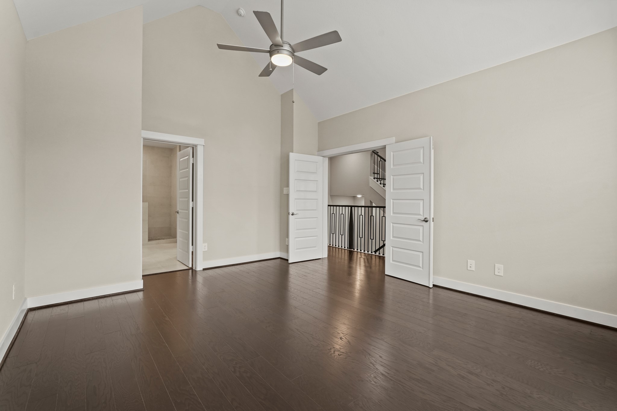 10972 Hewitt Cliff Lane Houston, TX 77043 - Photo 11 of 23 a view of empty room with wooden floor and ceiling fan