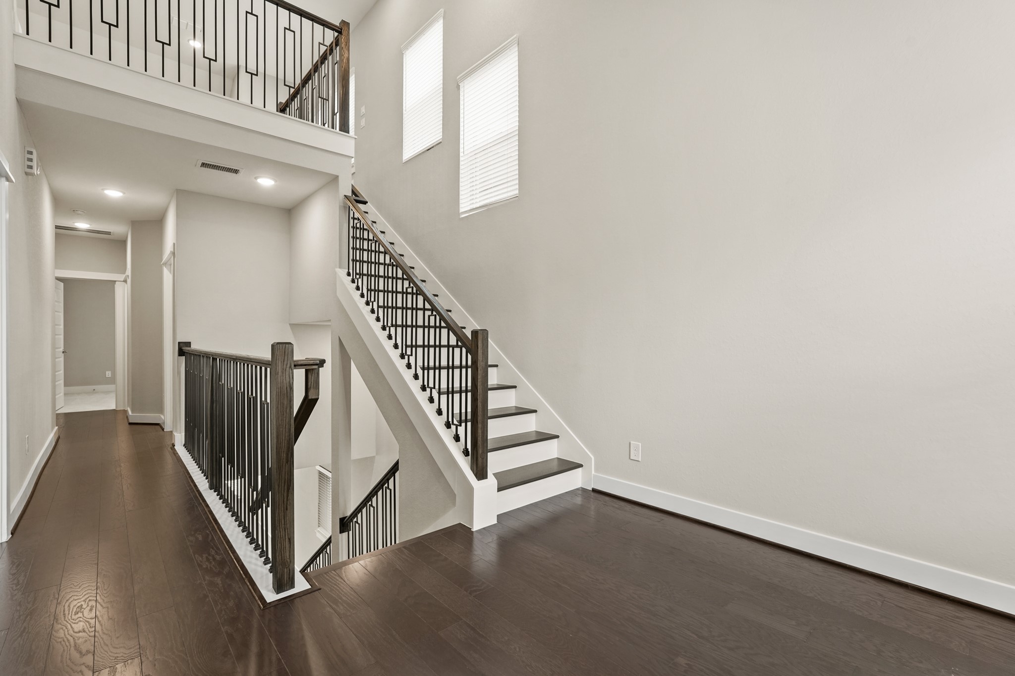 10972 Hewitt Cliff Lane Houston, TX 77043 - Photo 15 of 23 a view of an entryway with wooden floor