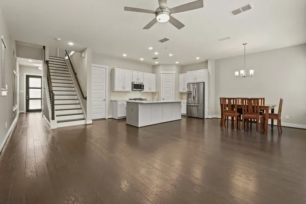 a view of kitchen with cabinets and wooden floor