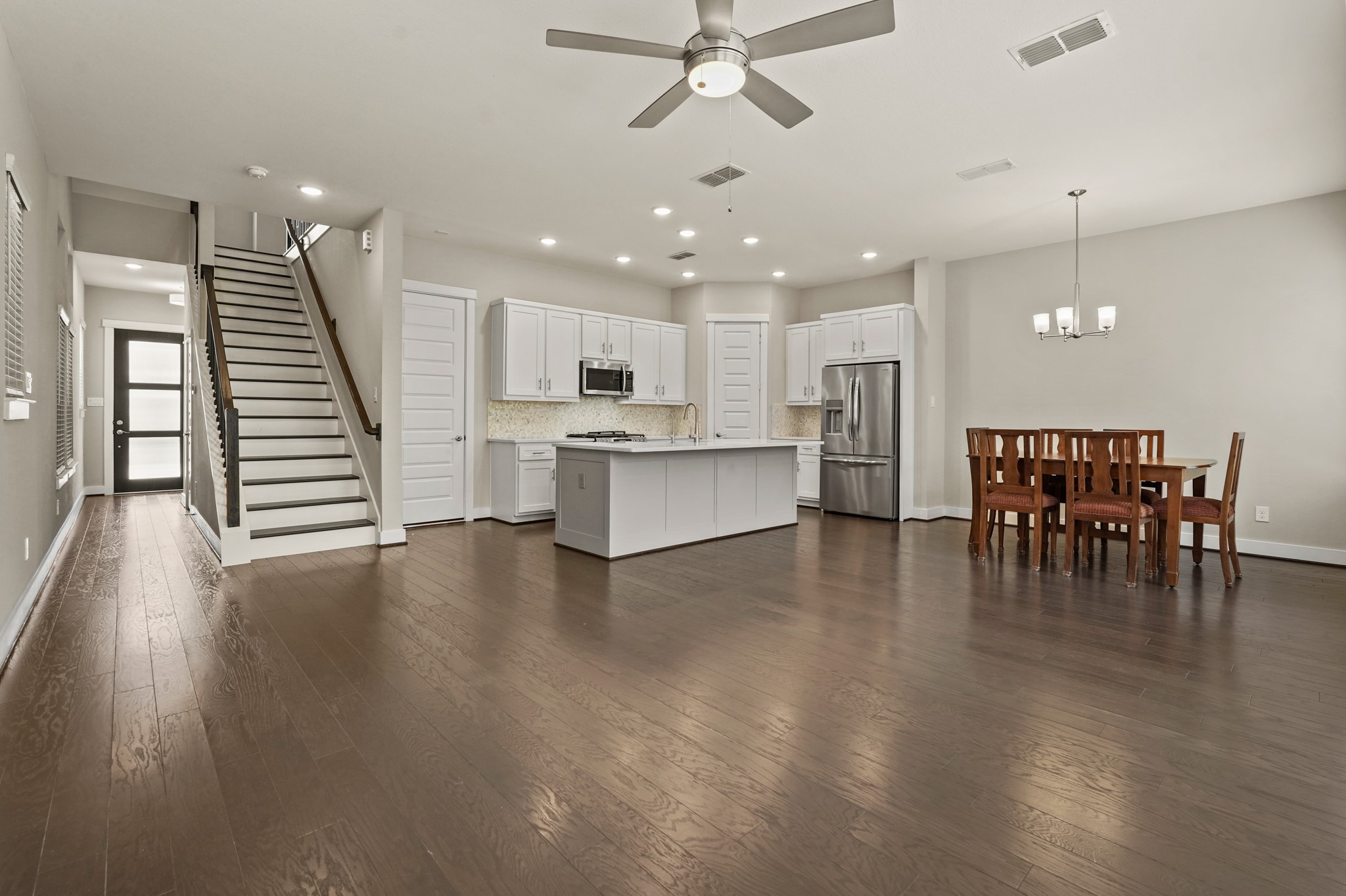 10972 Hewitt Cliff Lane Houston, TX 77043 - Photo 2 of 23 a view of kitchen with cabinets and wooden floor
