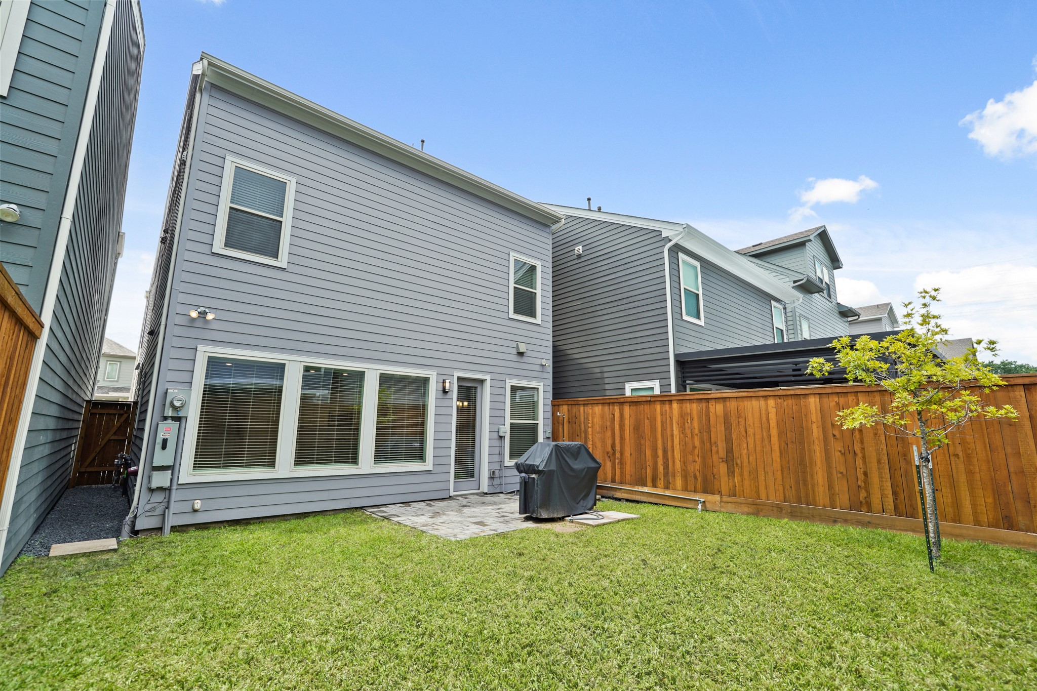 10972 Hewitt Cliff Lane Houston, TX 77043 - Photo 22 of 23 a view of a house with backyard