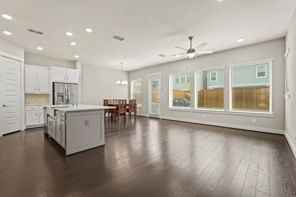 a view of kitchen with furniture and wooden floor