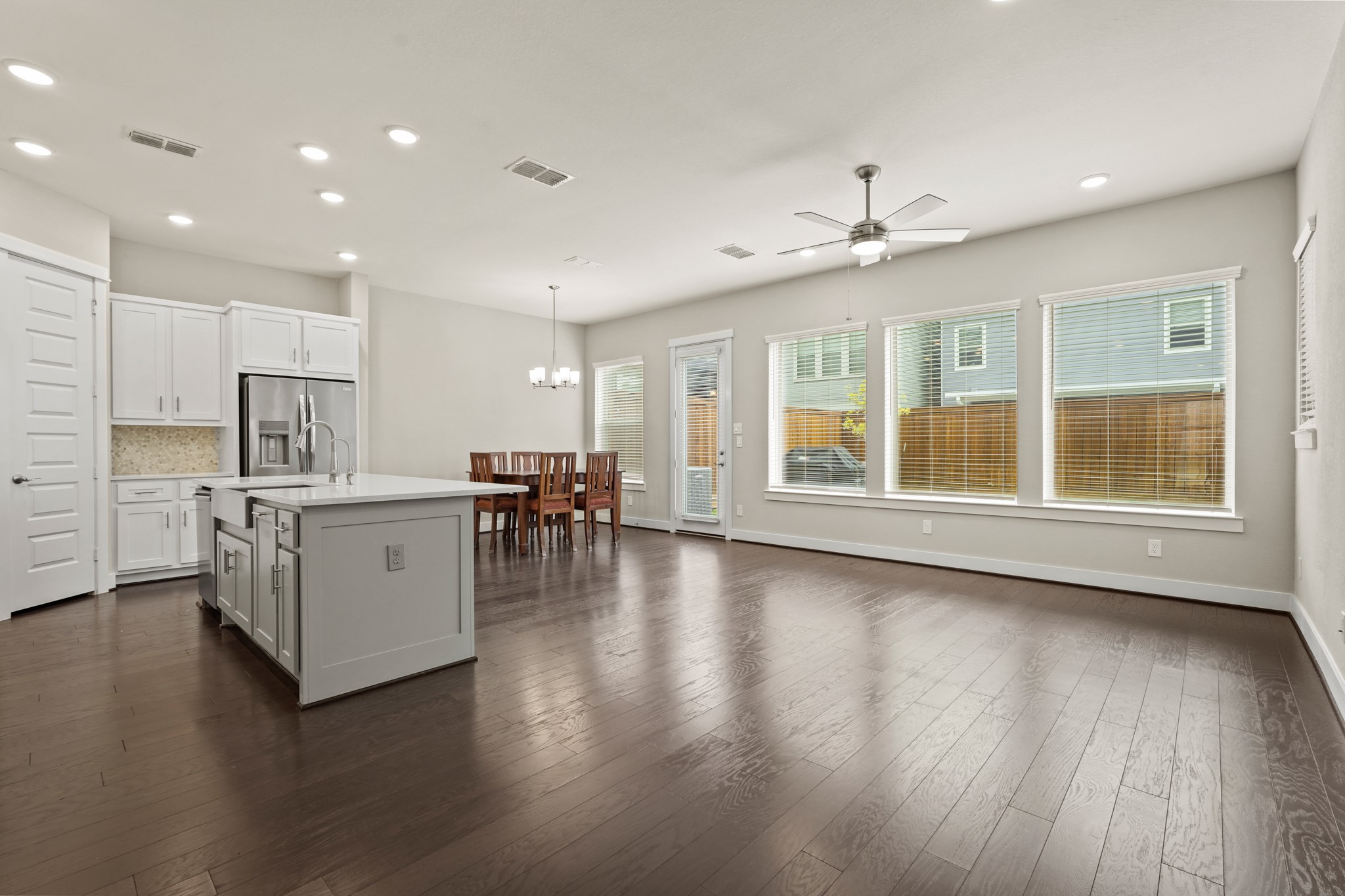 10972 Hewitt Cliff Lane Houston, TX 77043 - Photo 3 of 23 a view of kitchen with furniture and wooden floor