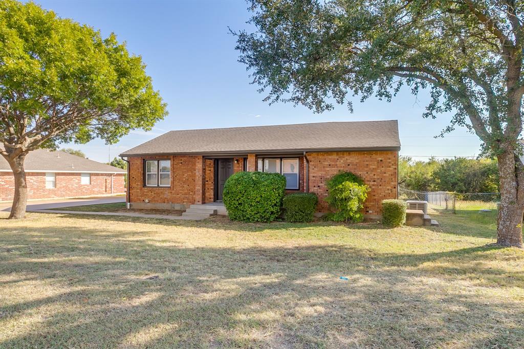 3105 Acton School Road Granbury, TX 76049 - Photo 1 of 40 a view of a house with backyard and sitting area