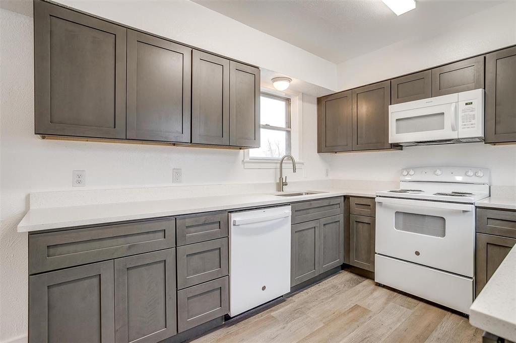 3105 Acton School Road Granbury, TX 76049 - Photo 15 of 40 a kitchen with cabinets stainless steel appliances and sink
