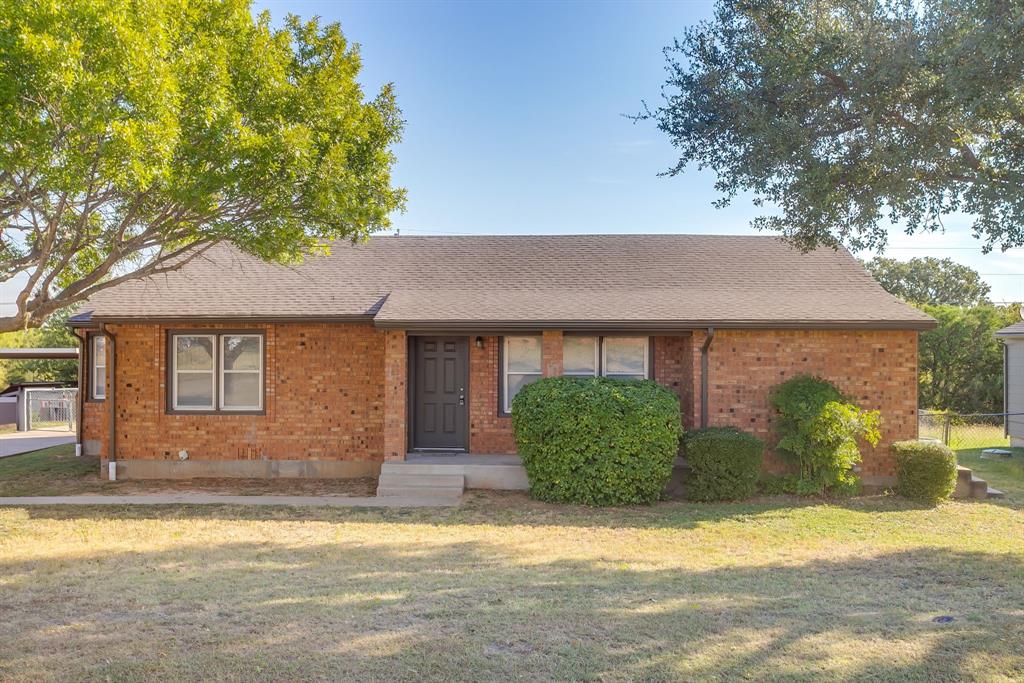 3105 Acton School Road Granbury, TX 76049 - Photo 2 of 40 a front view of a house with a yard and garage