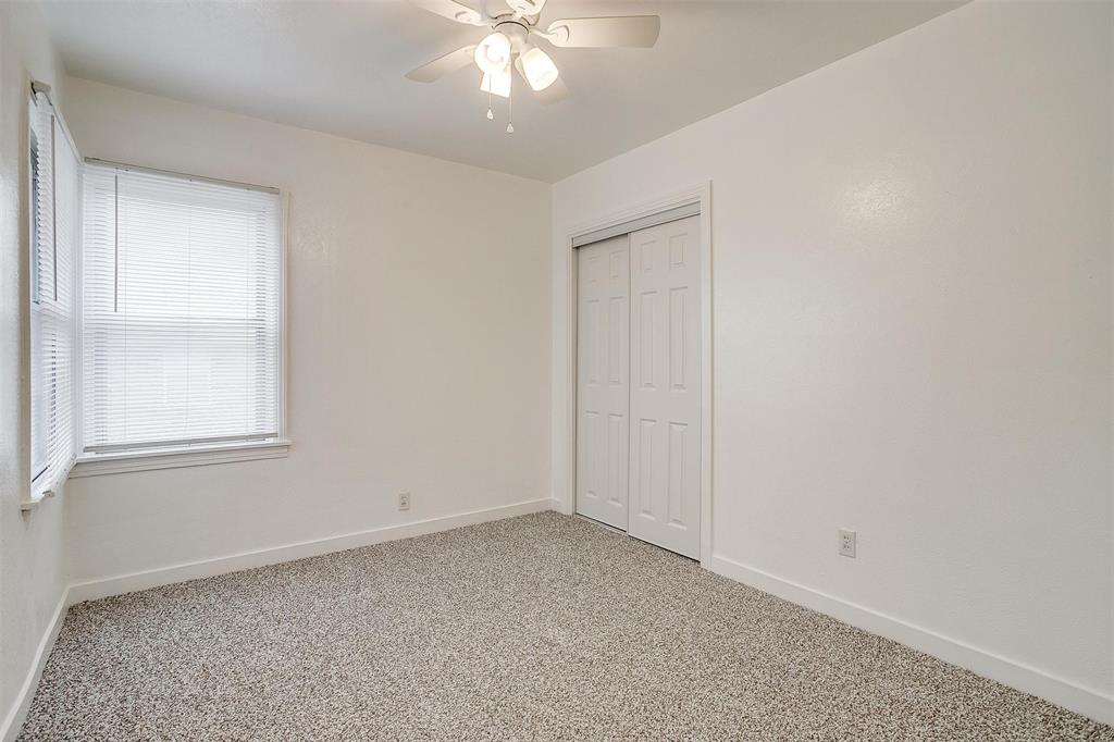 3105 Acton School Road Granbury, TX 76049 - Photo 23 of 40 an empty room with a chandelier fan