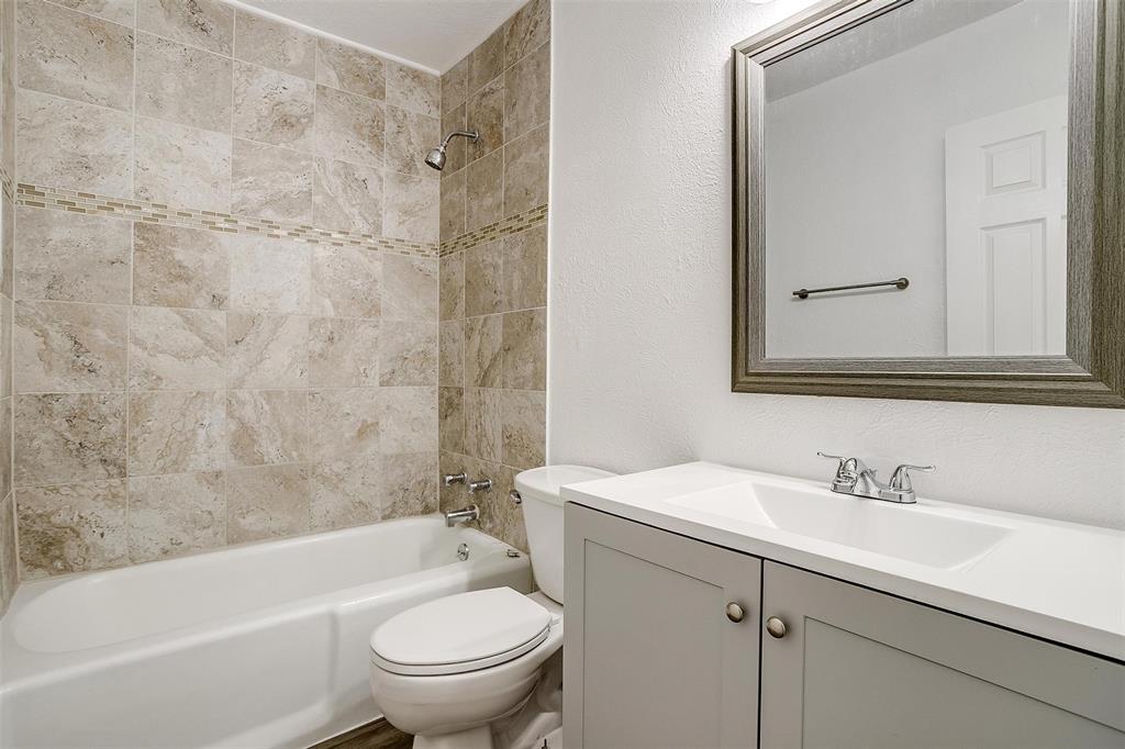 3105 Acton School Road Granbury, TX 76049 - Photo 25 of 40 a bathroom with a sink a toilet and a bathtub