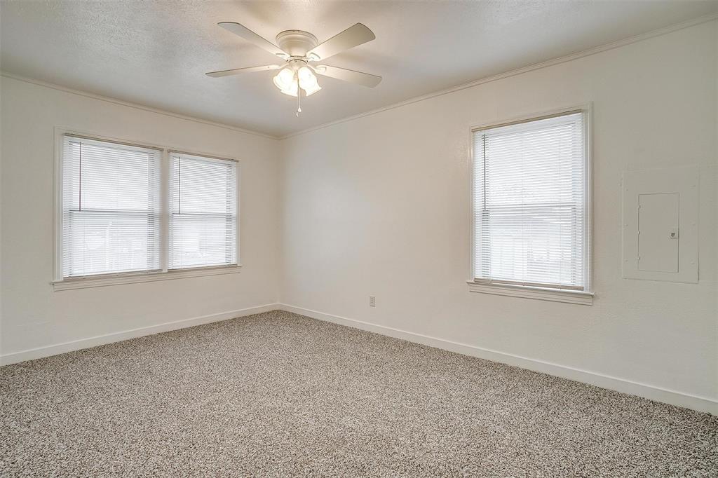 3105 Acton School Road Granbury, TX 76049 - Photo 27 of 40 an empty room with windows and fan