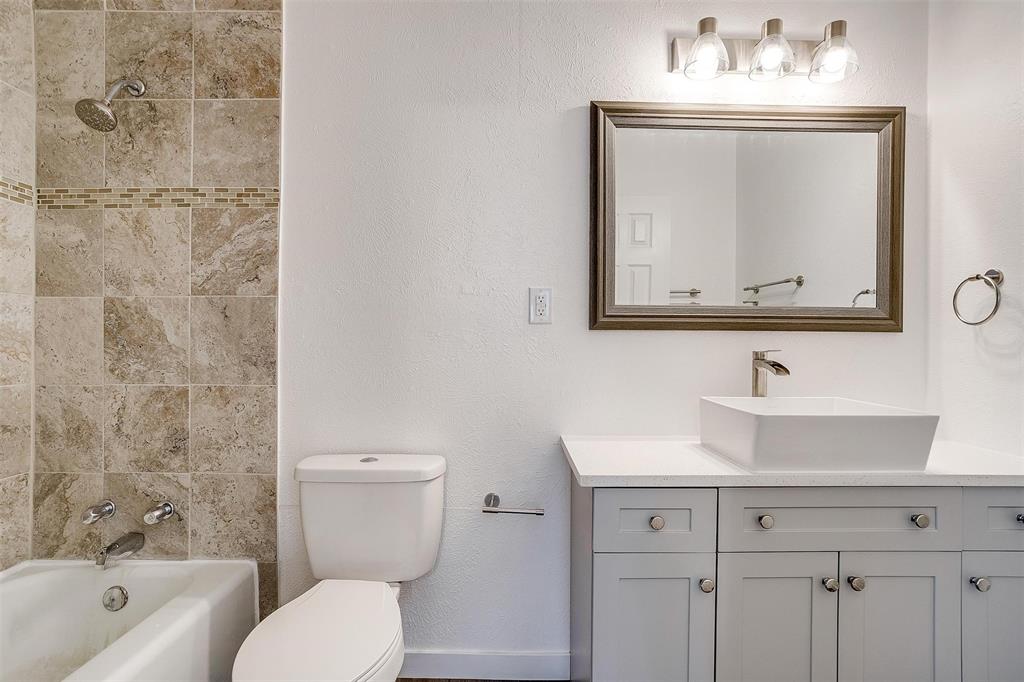 3105 Acton School Road Granbury, TX 76049 - Photo 33 of 40 a bathroom with a toilet sink and mirror