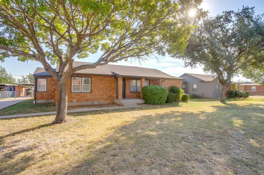 3105 Acton School Road Granbury, TX 76049 - Photo 4 of 40 a front view of a house with a yard and garage