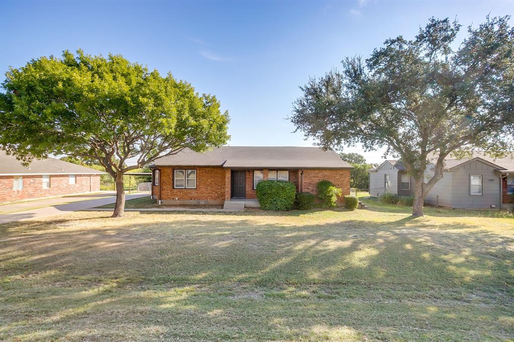 3105 Acton School Road Granbury, TX 76049 - Photo 5 of 40 a front view of a house with a yard and garage