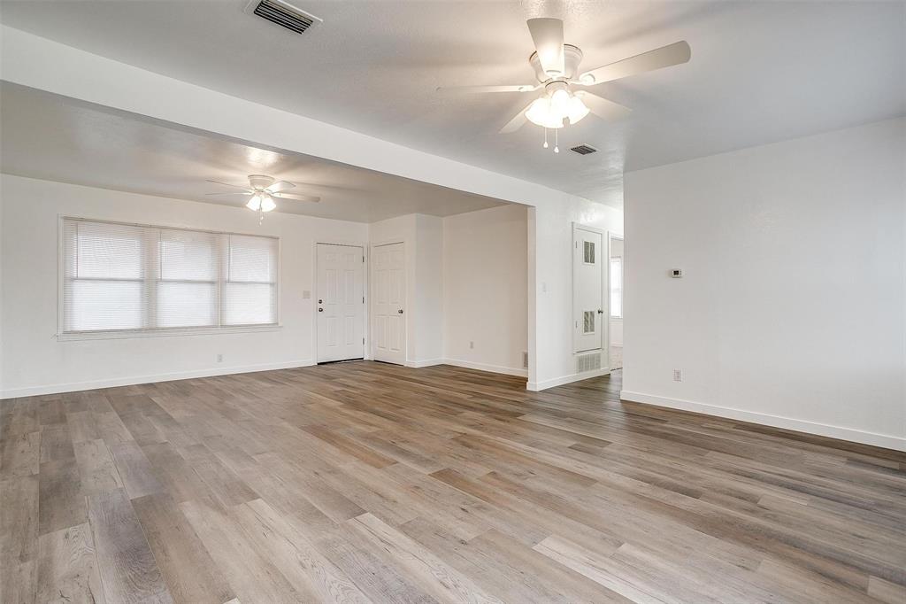 3105 Acton School Road Granbury, TX 76049 - Photo 9 of 40 wooden floor in an empty room with a window