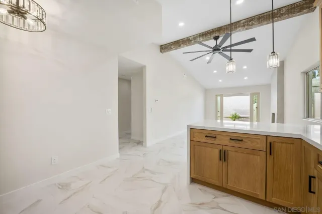 a view of a kitchen with a sink and cabinets