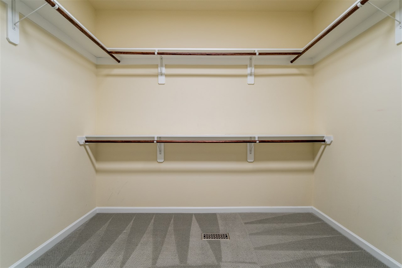 1521 Rodessa Run Raleigh, NC 27607 - Photo 22 of 29 Wooden shelving, tons of storage in your owner's suite walk in closet. Owner's Walk in Closet