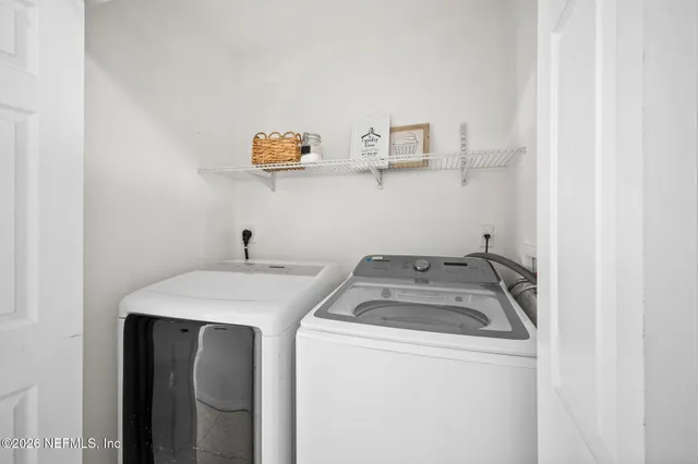a utility room with dryer and washer