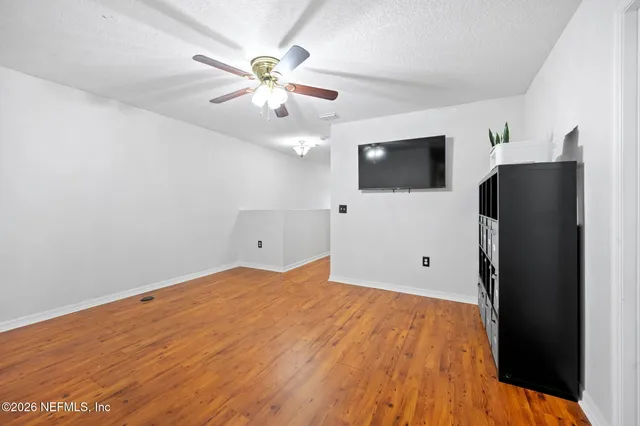 a view of a livingroom with a flat screen tv