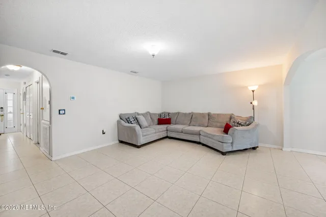a living room with furniture and a table