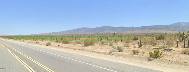 a view of an ocean and a mountain