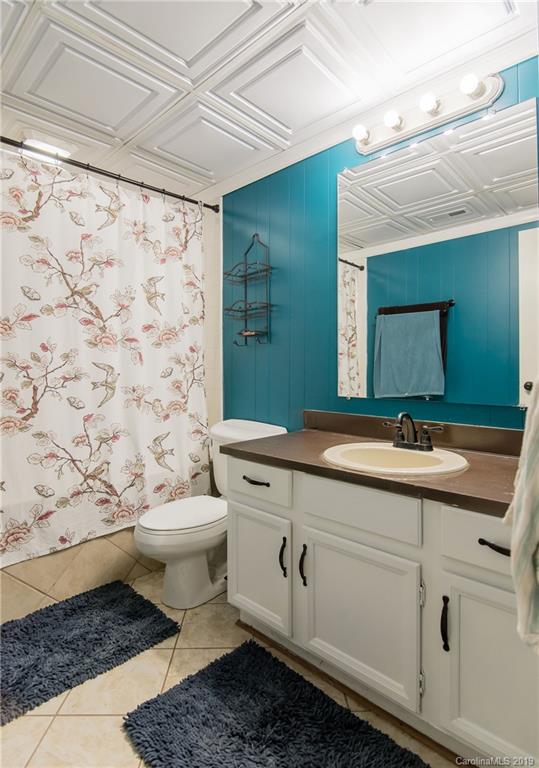 4043 Windward Drive Tega Cay, SC 29708 - Photo 13 of 25 a bathroom with a sink toilet and mirror