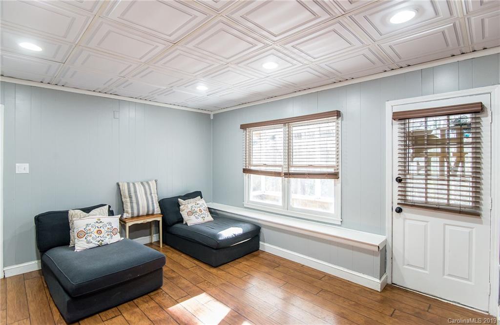 4043 Windward Drive Tega Cay, SC 29708 - Photo 19 of 25 a living room with furniture and a window