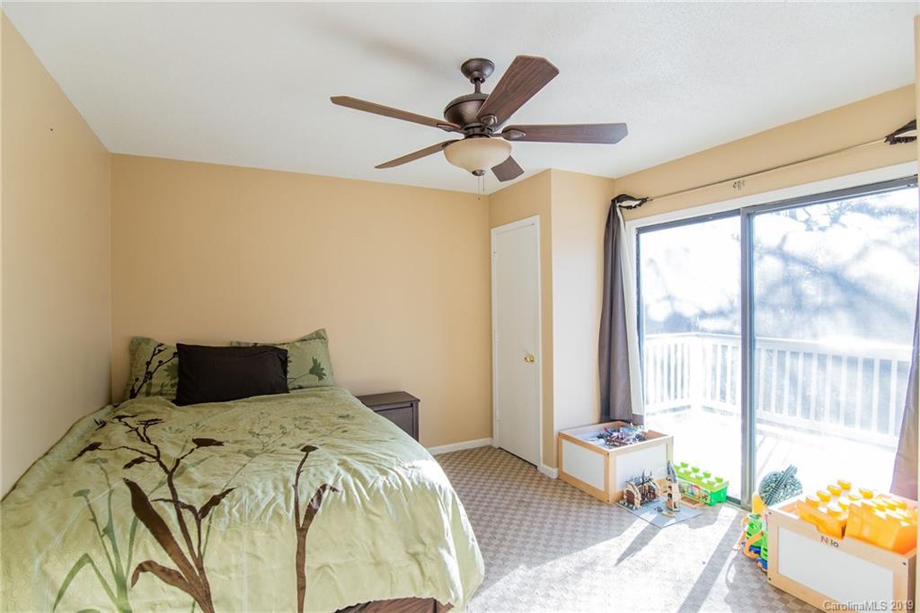 4043 Windward Drive Tega Cay, SC 29708 - Photo 20 of 25 a bedroom with a bed and a large window