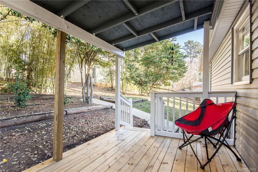 4043 Windward Drive Tega Cay, SC 29708 - Photo 24 of 25 a view of a porch with furniture and a yard
