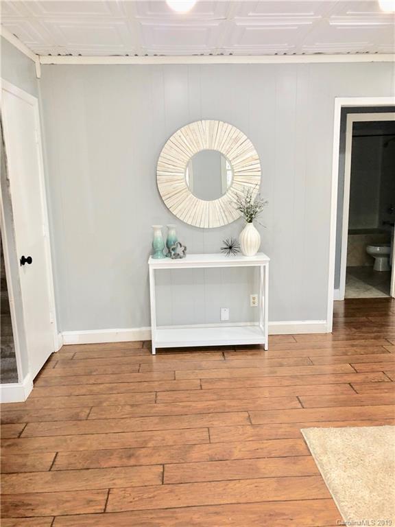4043 Windward Drive Tega Cay, SC 29708 - Photo 4 of 25 a view of a room with wooden floor and a sink