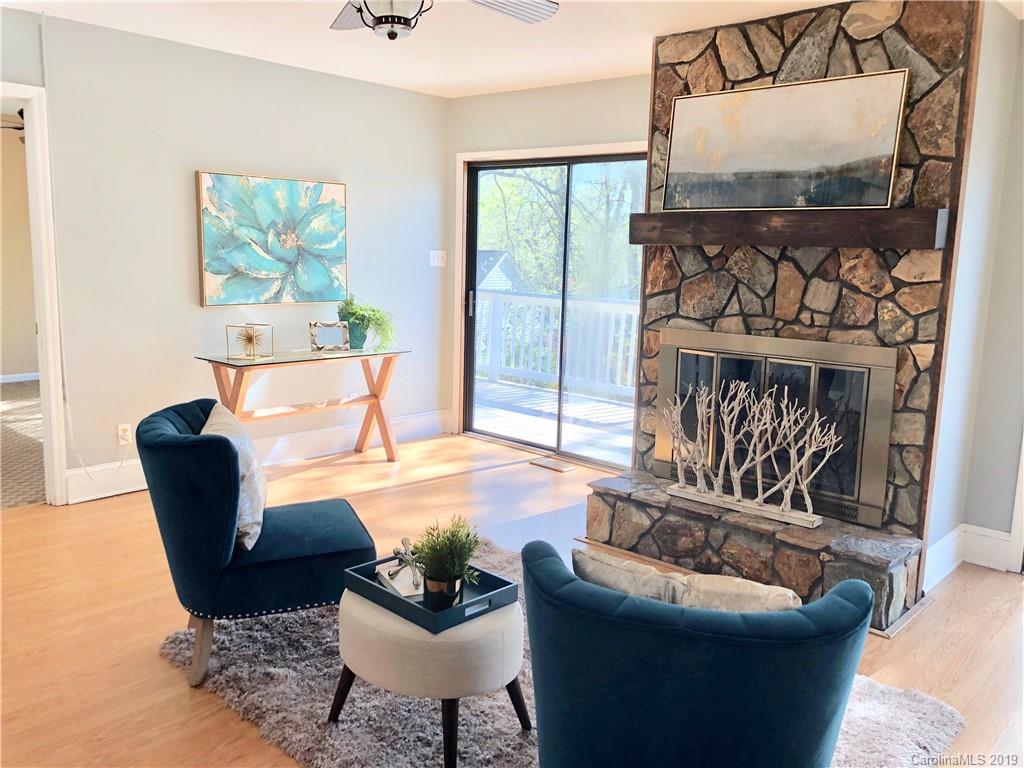 4043 Windward Drive Tega Cay, SC 29708 - Photo 7 of 25 a living room with furniture and a fireplace