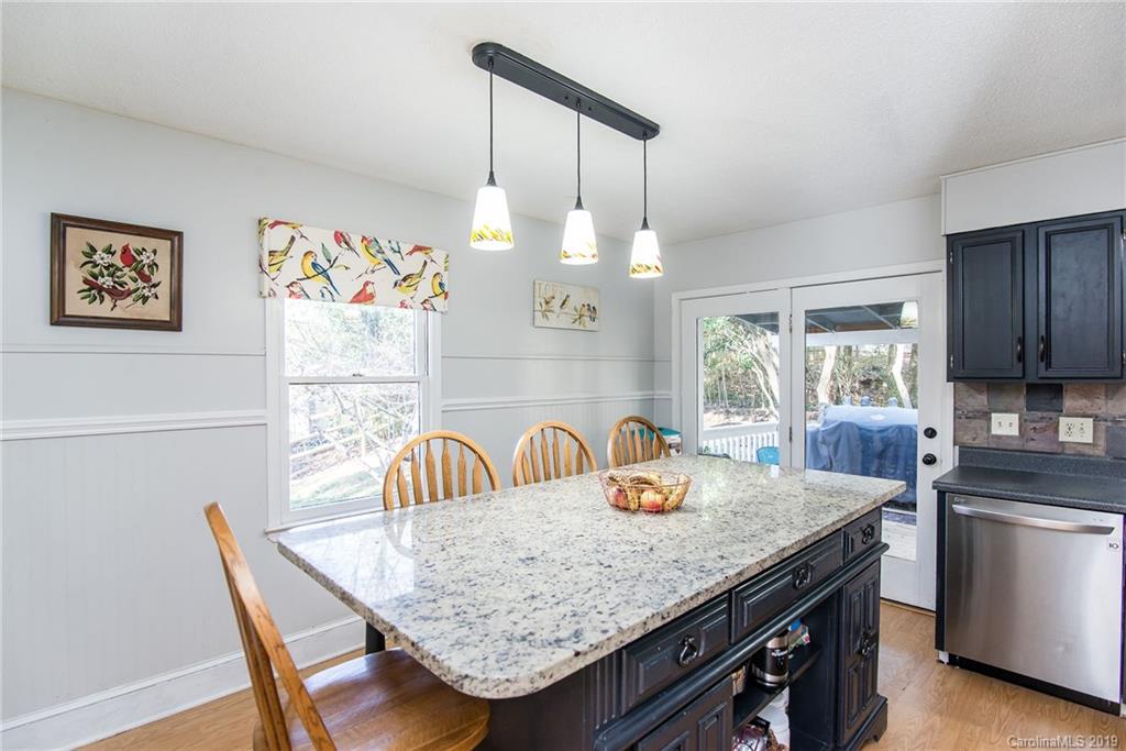 4043 Windward Drive Tega Cay, SC 29708 - Photo 10 of 25 a kitchen with granite countertop a sink and a stove
