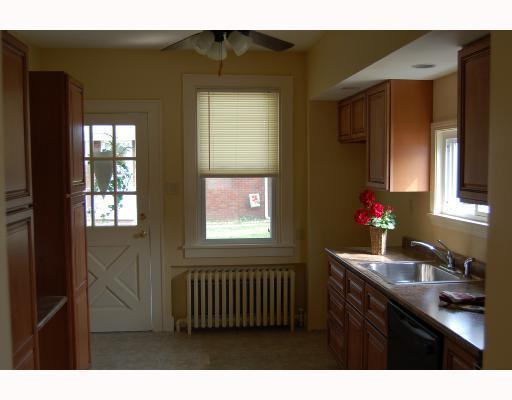 14 Braddock Rd Avenue Mount Pleasant, PA 15666 - Photo 9 of 10 Kitchen. Beautiful new kitchen boasts cherry cabinets, 2 deep pantry cabinets with space for stackable washer/dryer if 1 floor living is required. Electric oven, microwave, and dishwasher are included.