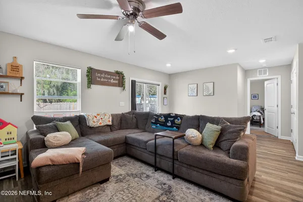 a living room with furniture and a window