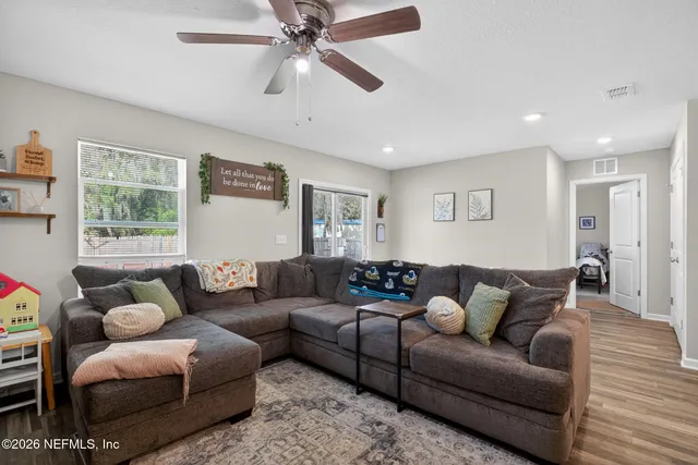 a living room with furniture and a window