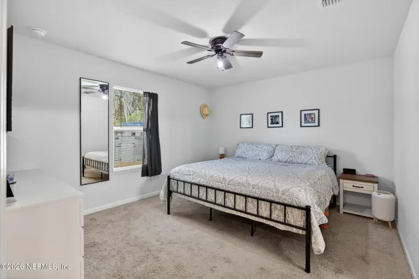 a bedroom with a bed and a cabinets