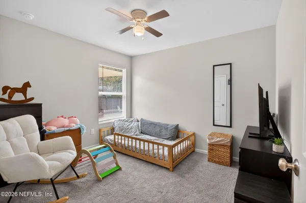 a living room with furniture and a window